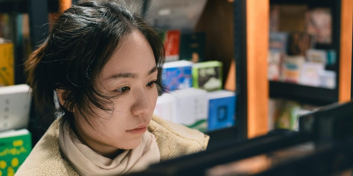 Reader browsing books in a small bookstore