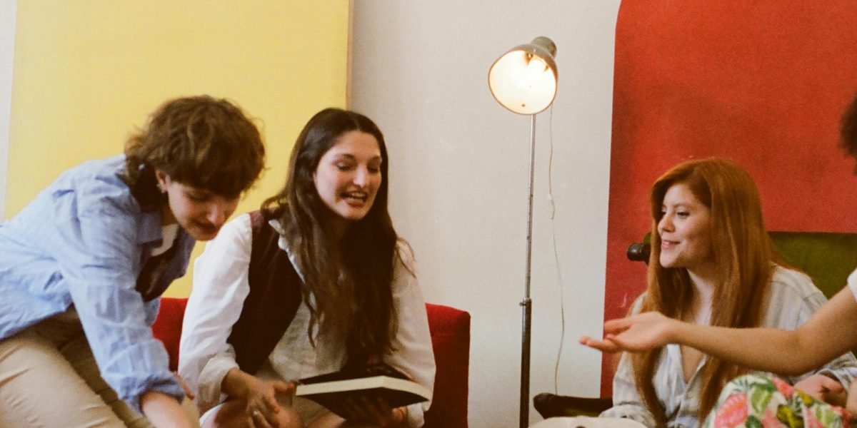 Friends in a book club engaging in lively discussion about their latest read.