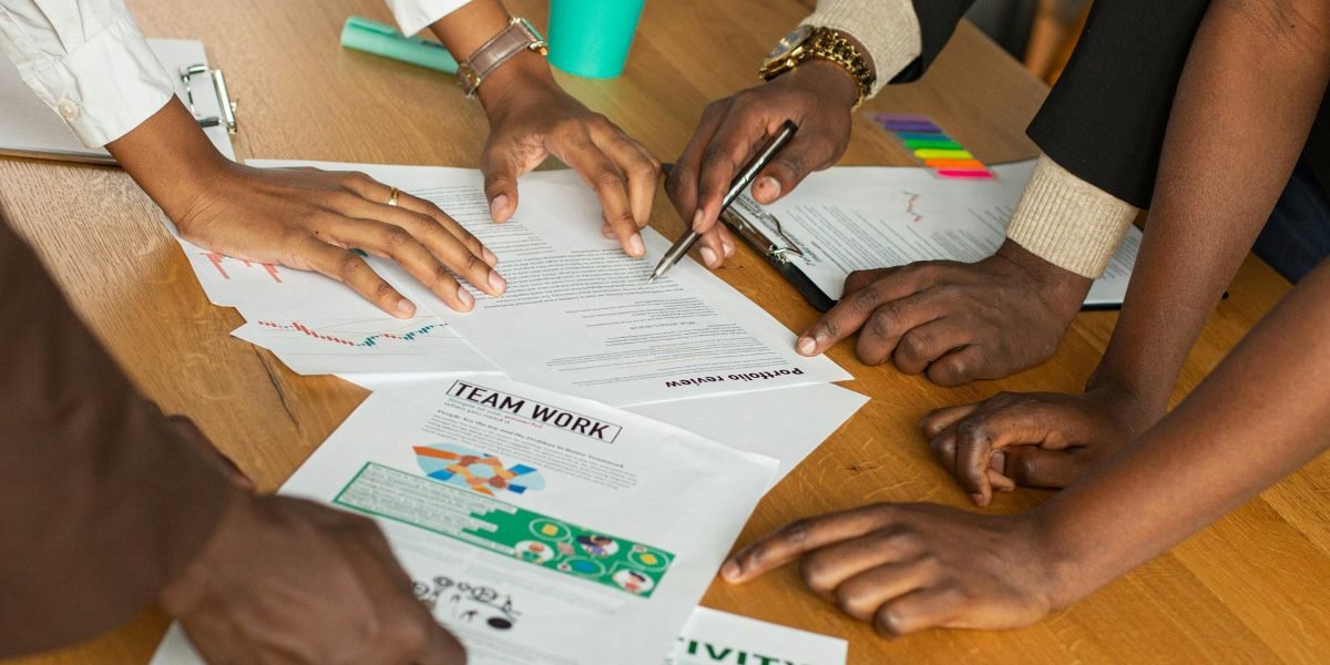 A collaborative team planning an activity or strategy on a whiteboard, symbolizing diverse idea curation.