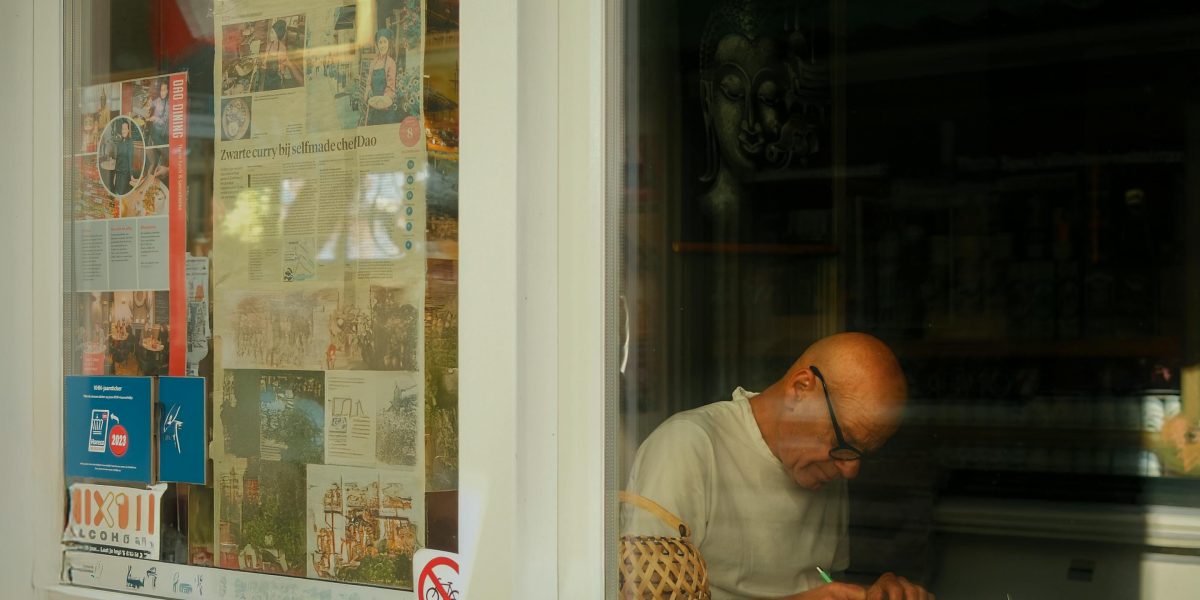 A reader engrossed in a book, exploring new literary horizons beyond their usual genres.