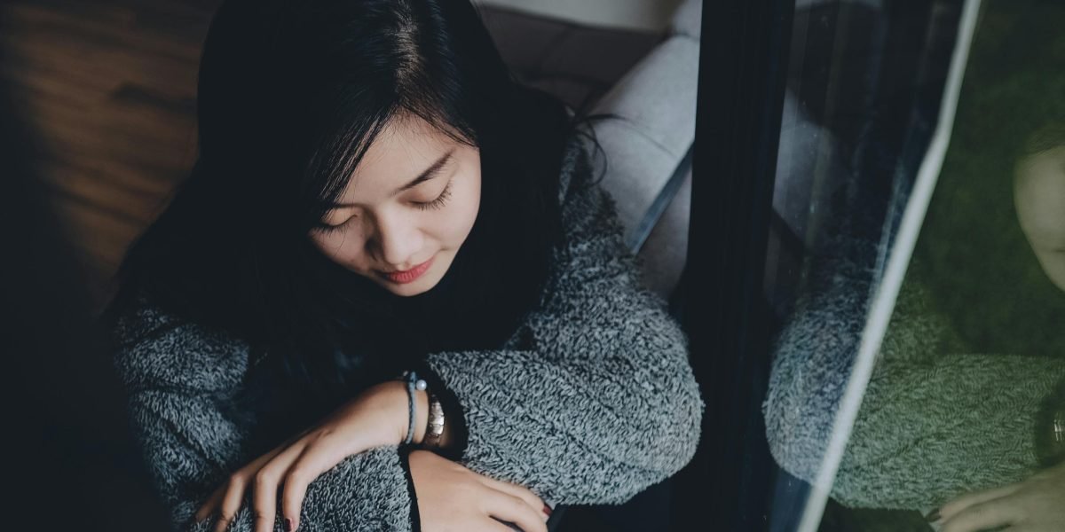 A reader reflecting on the profound emotional impact of a story, connecting deeply with its characters.