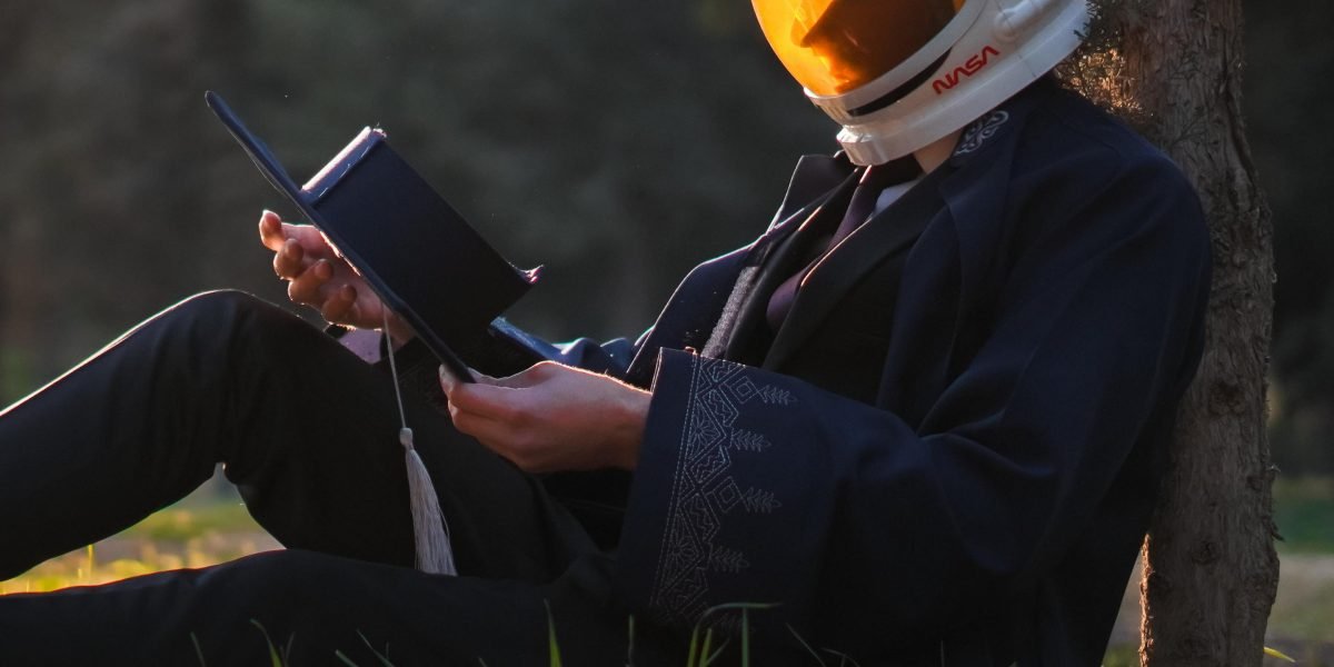 A person completely engrossed in a book, demonstrating the immersive experience of a captivating story.